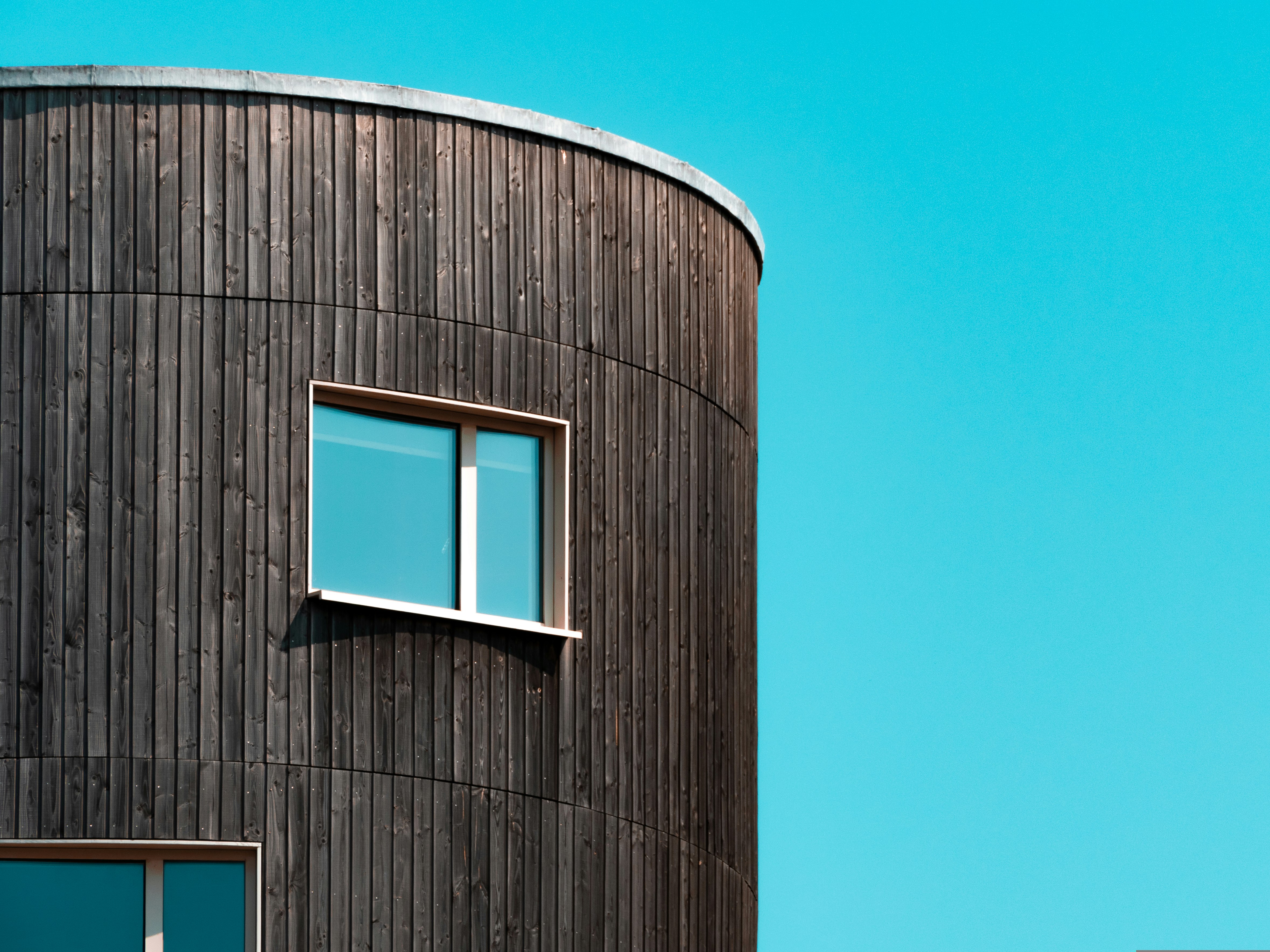 brown and white concrete building under blue sky during daytime